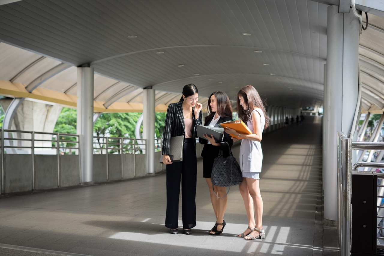 Business women discussing in the tunnel